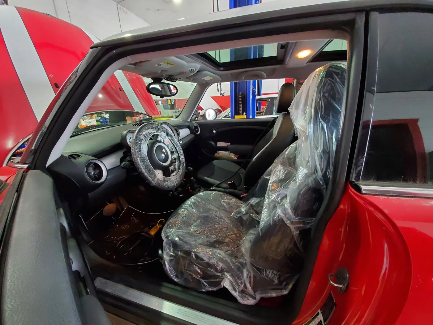 A MINI in the service bay during an interior inspection